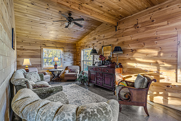 Comfortable nook for lounging with sofas and chairs off to the side of the wedding venue